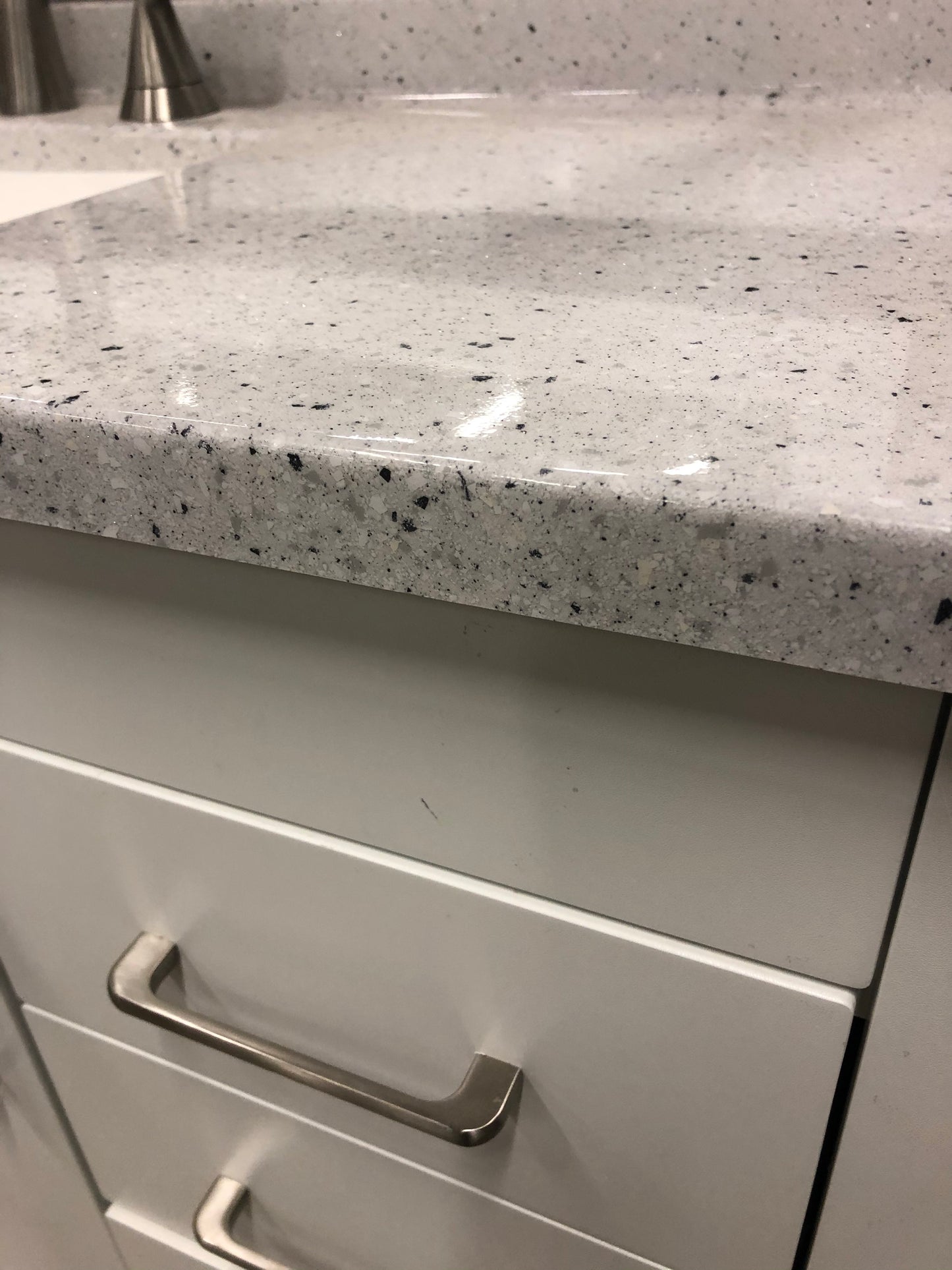 Home decorators Westcourt 36 in. W x 18.75 in. D Bath Vanity in White with Solid Surface Top in Silver Ash with White Sink.