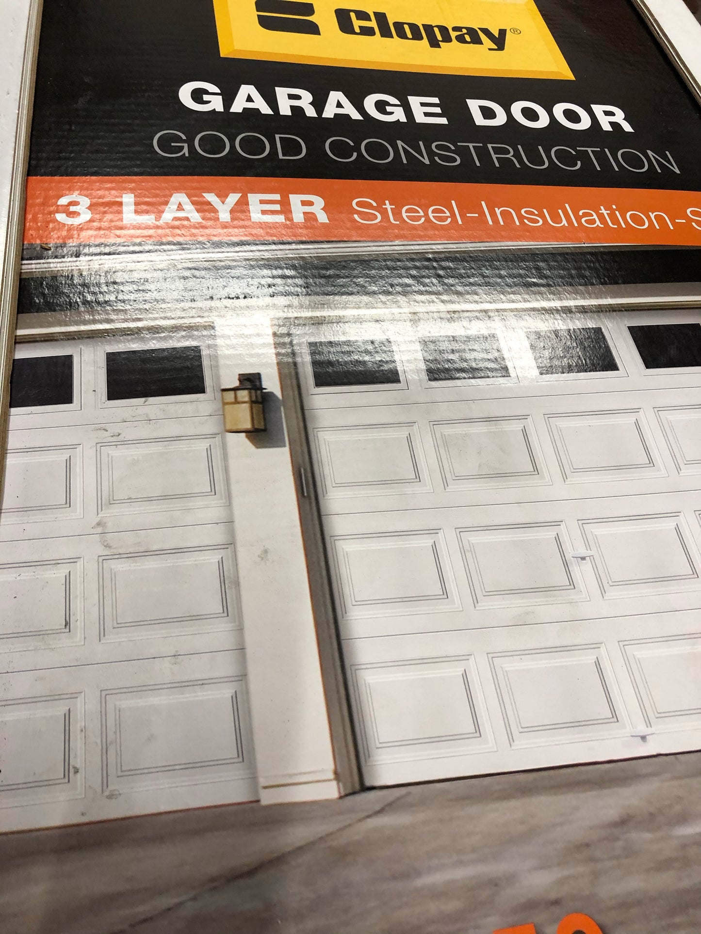 Clopay Classic Collection 9 ft. x 7 ft. 6.5 R-Value Insulated White Garage Door with Plain Windows.